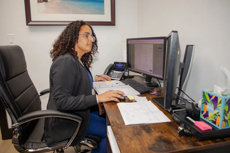 An Entrust team member at work in the clinic